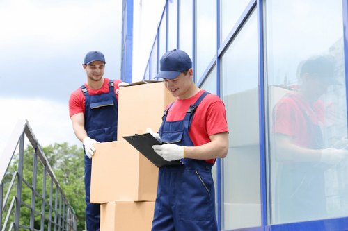 Man with van loading household items for a West Ham removal