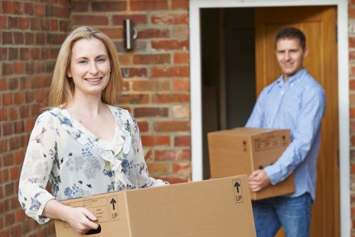 Local office movers preparing desks and equipment for relocation