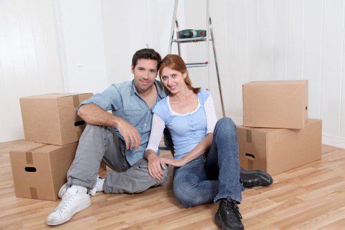 Loading furniture and boxes into a removals van in West Ham