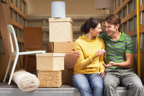 Professional packers organizing boxes for a local removal service